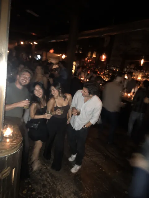 A fictional group photo, dark and blurry